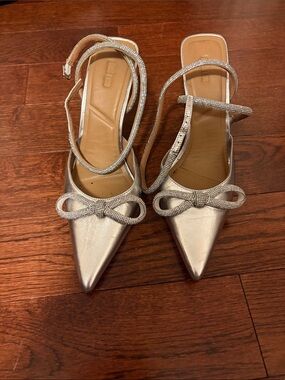 Pointed-Toe Silver Bow Slingback Heels with Ankle Wrap